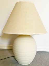A Vintage Ceramic Table Lamp With Linen Shade