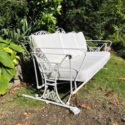 A Vintage Woodard Orleans Wought Iron Gliding Sofa