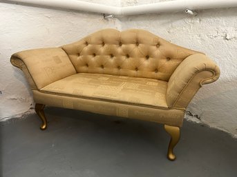 18th Century Style Sofa With Gold Fabric With Printing On It