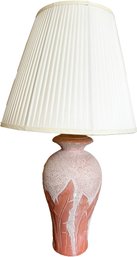 A Vintage Ceramic Table Lamp With Pleated Shade