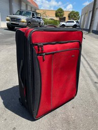 A Red Fabric Suitcase