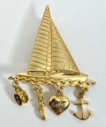 SIGNED JJ GOLD TONE SAILBOAT WITH DANGLE CHARMS BROOCH