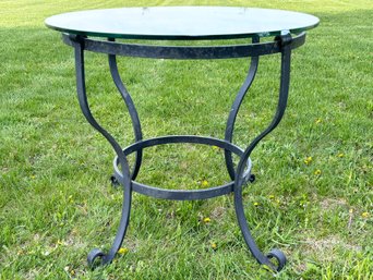 A Vintage Cast Iron Glass Top Bistro Table