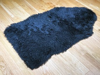 A Faux Black Sheepskin Throw Rug