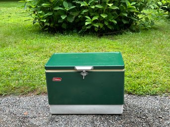 A Vintage Green Metal Coleman Cooler