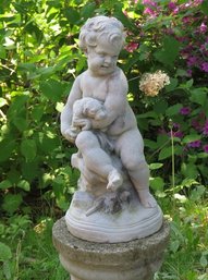 A Cherubic Young Boy Holding His Puppy Cast Concrete Garden Statue