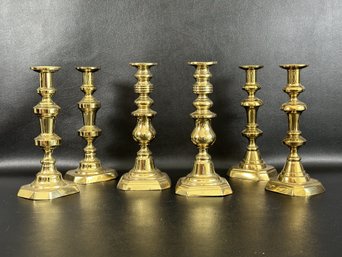 A Grouping Of Vintage Candlesticks In Brass