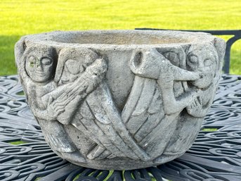A Cast Concrete Planter With Angel Motif