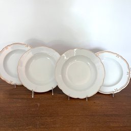 A Complimentary Set Of White Porcelain Dishes With Gilt Detail