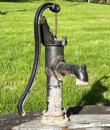 An Early 20th Century Cast Iron Well Pump - On Wood Mount