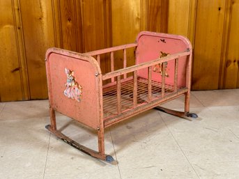 A Vintage Metal 'Doll-E-Cradle' In Pink With Attached Music Box By Amsco