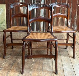 A Trio Of Vintage Carved Mahogany Cane Seated Side Chairs