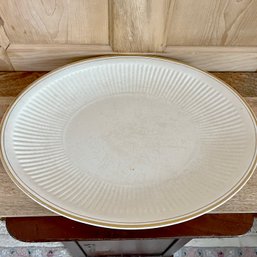 A Sebring Ivory Porcelain Fluted Platter With Gold Rim