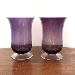 A Pair Of Purple Glass Etched Vases