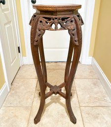 An Ornately Carved Marble Top Plant Stand