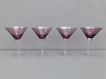 A Set Of Four Plum-colored Stemmed Martini Glasses