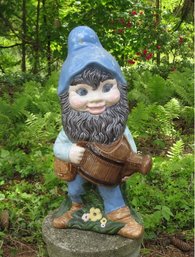 An 18' Ceramic Garden Gnome With Watering Can