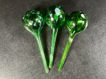 A Set Of Three Self-Watering Plant Globes In Green Blown Glass