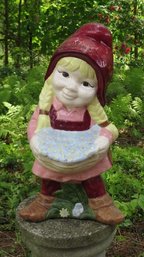 An 18' Ceramic Garden Gnome Girl With Flower Basket