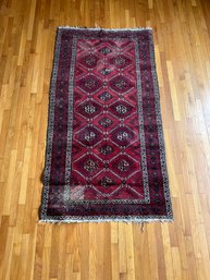 Red Floor Rug With Geometric Pattern