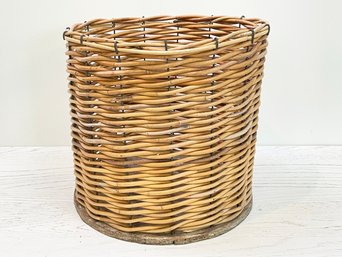 A Woven Wicker Wastebasket Or Cache Pot