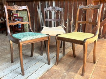 A Trio Of Carved Mahogany Side Chairs