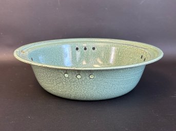 A Vintage Enamelware Colander In Green