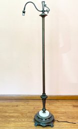 A Metal And Marble Standing Lamp