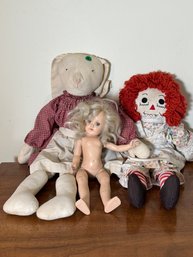 A RAGGEDY ANN DOLL AND TWO OTHER DOLLS