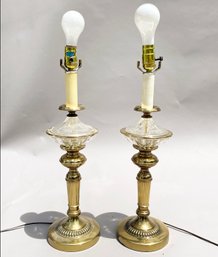 A Pair Of Brass And Glass Lamps