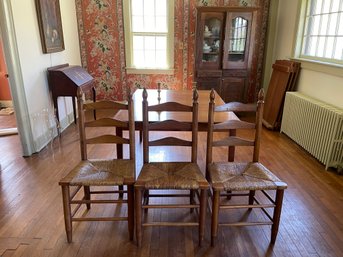 Three Antique Ladder Back And Rush Seats Dining Chairs.