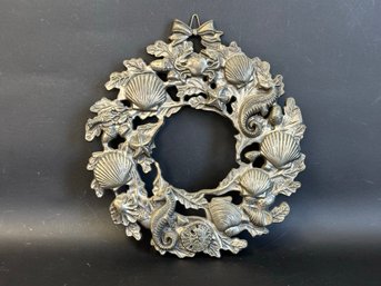 A Silver-Toned Metal Wreath Trivet, Seaside Theme