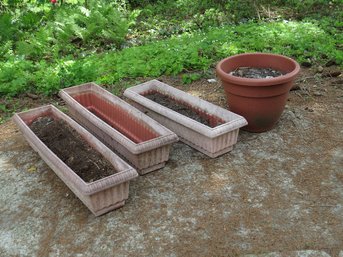 A Group Of 4 Outdoor Window Box And Round Plastic Planters