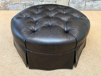 A Tufted And Tooled Leather Ottoman