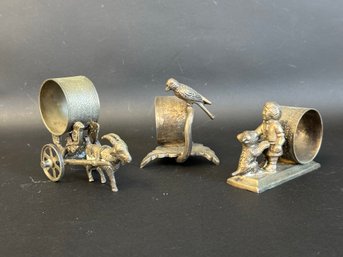 A Small Collection Of Victorian Napkin Rings With Figural Designs