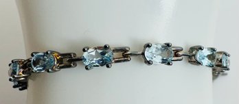 STERLING SILVER FACETED BLUE TOPAZ LINK BRACELET