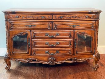 A Magnificent Carved And Inlaid Wood Server With Glass Paneled Doors In French Provincial Style