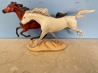 A Franklin Mint Porcelain Group Of 2 Running Horses
