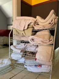 Lots Of Bathroom Towels, Rugs And Rack