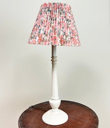 A Modern Wood Stick Lamp With Pleated Floral Shade