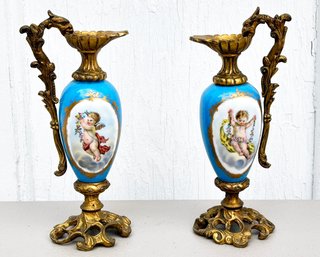 A Pair Of Antique German Pitcher Form Candlesticks With Porcelain Vessels In Ormolu Settings