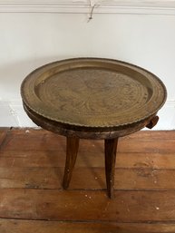 A Teak And Brass Tray Table