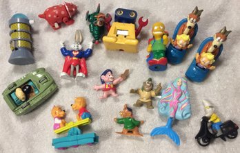 Assortment Of Action Figures And Vehicles