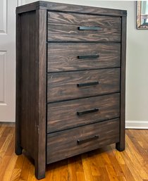 A Modern Chest Of Drawers With Oil Rubbed Bronze Hardware