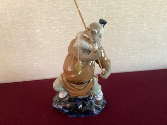 Asian Fishing Figurine