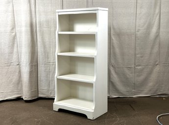 A Small, Four-Shelf Painted Bookcase With A Tapered Profile