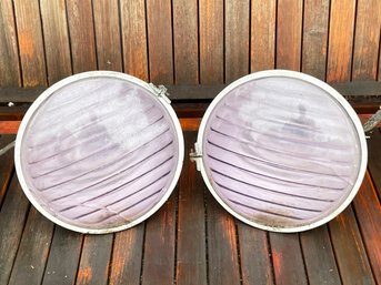 A Pair Of Vintage Outdoor Lights With Colored Glass