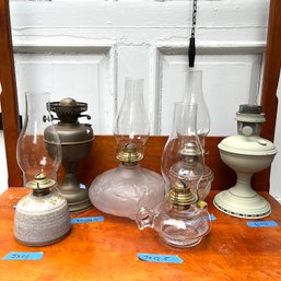 An Assortment Of Vintage Oil Lamps