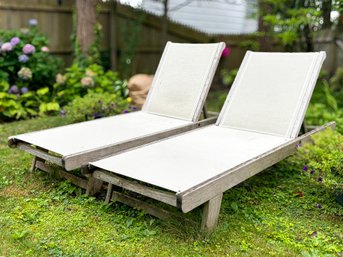 A Pair Of Teak And Mesh Lounge Chairs By Smith & Hawken