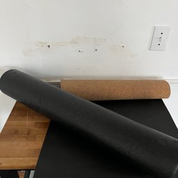 A Foam Roller And Cork Backed Rubber Exercise Mat